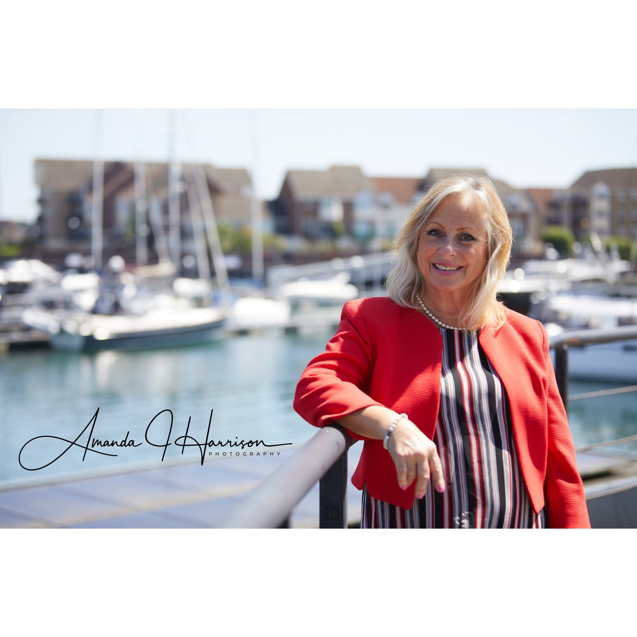 amanda harrison-professional headshot Professional Headshot of lady stood in front of Marina on a sunny day